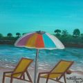 spiaggia con ombrellone colorato