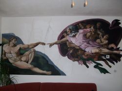 Riproduzione della creazione di Adamo di Michelangelo
