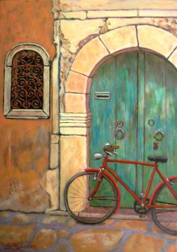 Bicicletta rossa su un'antica facciata