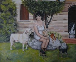 Donna con i suoi 6 cagnolini